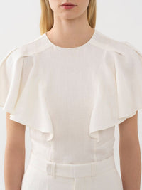 OK PORTE_Blouse volantée sans manches en lin - Iconic Milk