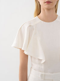 OK PORTE_Blouse volantée sans manches en lin - Iconic Milk