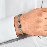Bracelet en cuir gris tressé avec fermoir en acier, finition PVD gris et trois anneaux